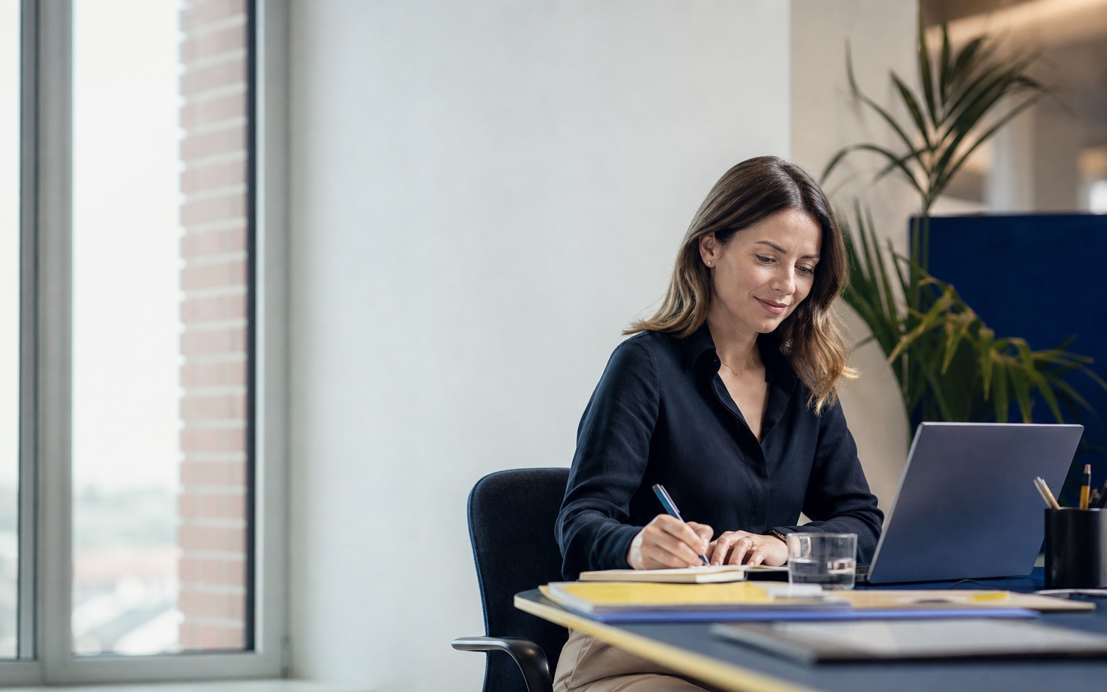 Operations leader working calmly while an AI agent handles routine tasks